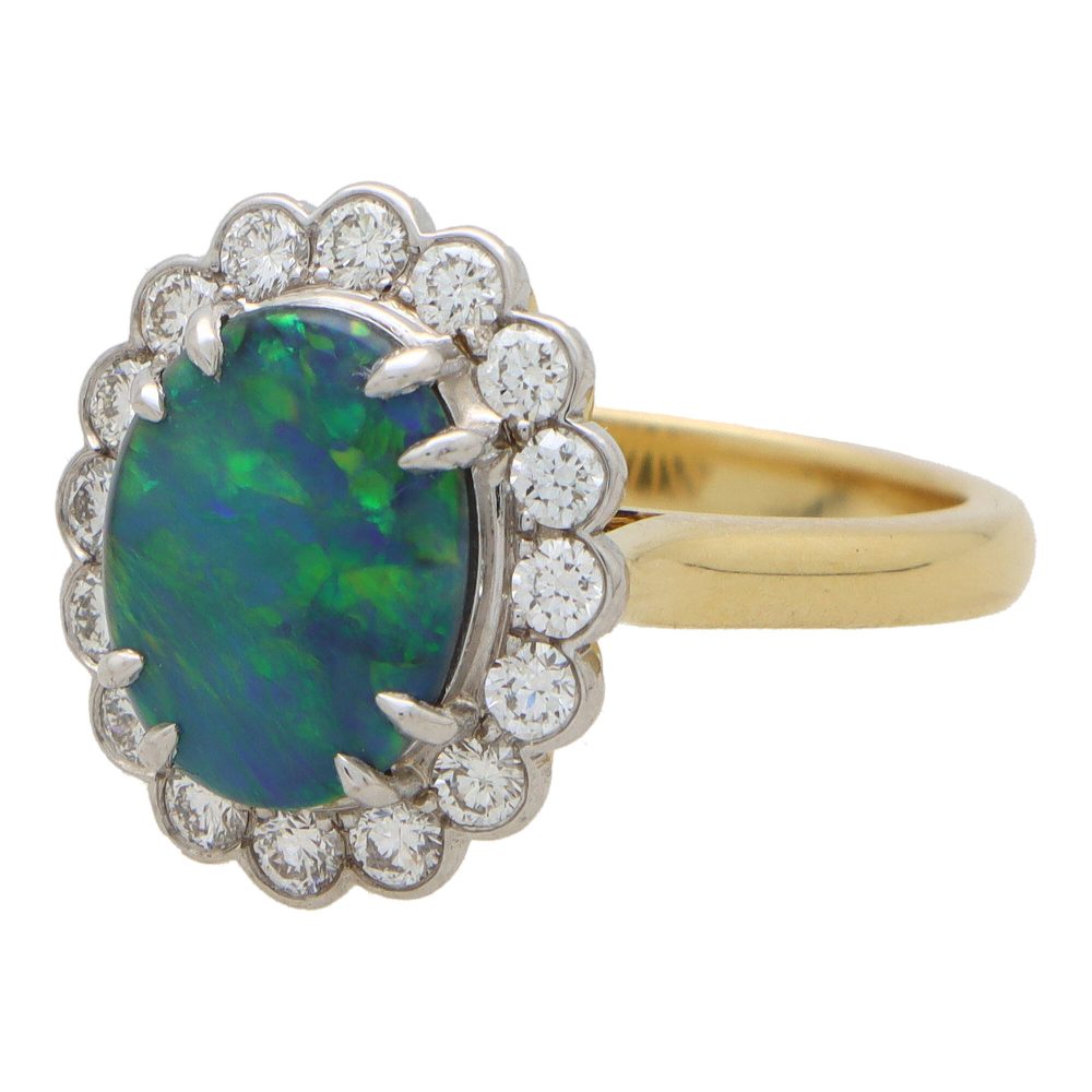 Black opal and diamond cluster ring in gold and platinum.