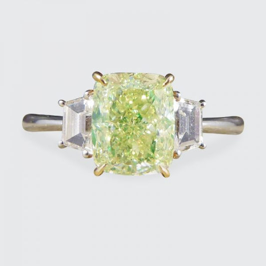 Fancy Light Green 2.40ct Diamond and White Diamond Three Stone Ring