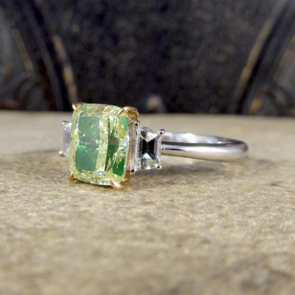 Fancy Light Green 2.40ct Diamond and White Diamond Three Stone Ring