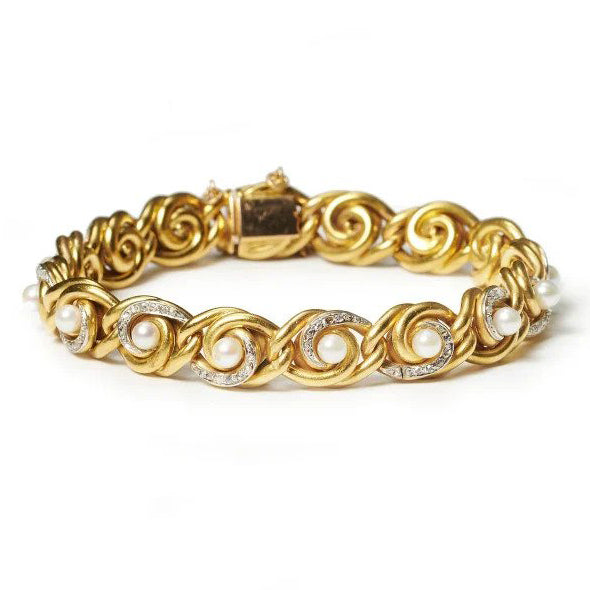 Antique French Art Nouveau Gold Swirl Bracelet with Diamonds and Pearls, 18ct yellow gold bracelet comprised of swirling knot links with white pearls and rose-cut diamonds. Circa 1900