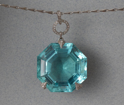 Georges Fouquet Art Deco 80ct Octagonal Aquamarine Pendant; in three rose-cut diamond-set platinum prongs, Signed by Master mark of Fouquet, Circa 1920.