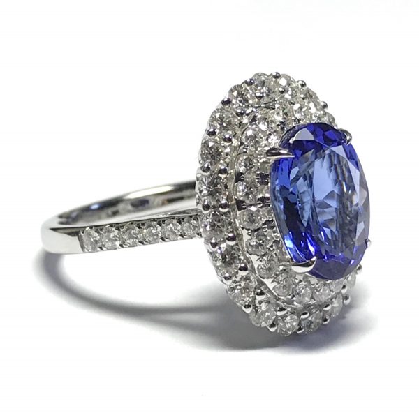 Tanzanite and diamond halo cluster ring
