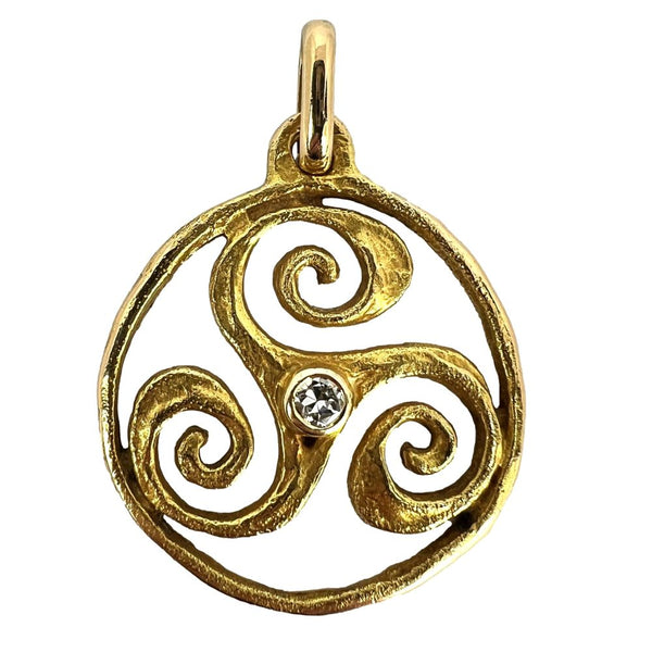 Gold Triskelion pendant with old cut diamond.
