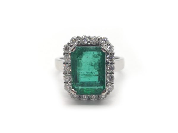 Emerald Cut Emerald and Diamond Cluster Ring in 18ct White Gold