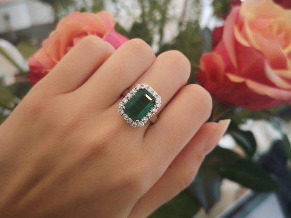 Emerald Cut Emerald and Diamond Cluster Ring in 18ct White Gold
