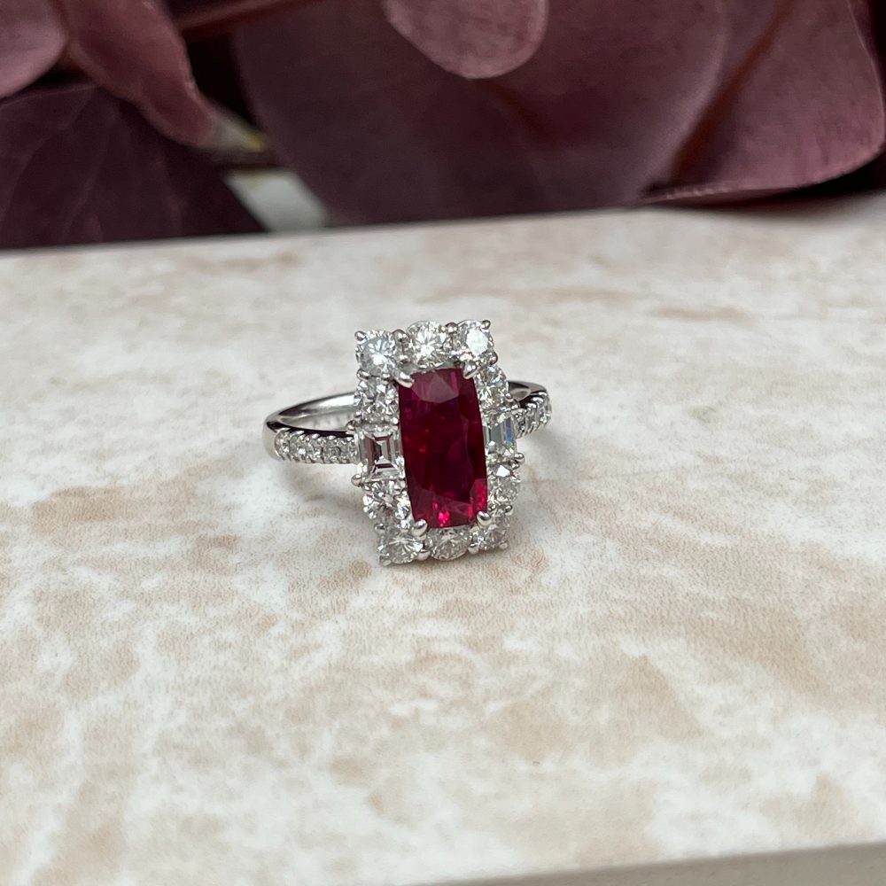 Natural no heat pigeon blood ruby and diamond cluster ring in platinum with GRS certification.