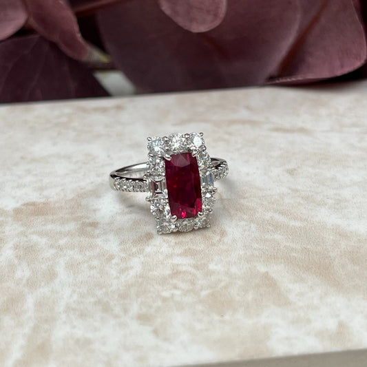 Natural no heat pigeon blood ruby and diamond cluster ring in platinum with GRS certification.