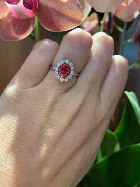 Padparadscha sapphire and diamond cluster ring