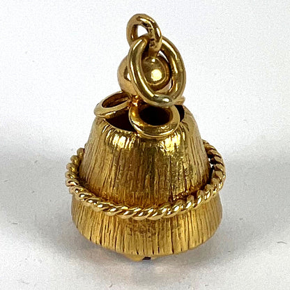 A yellow gold pendant, on a white background