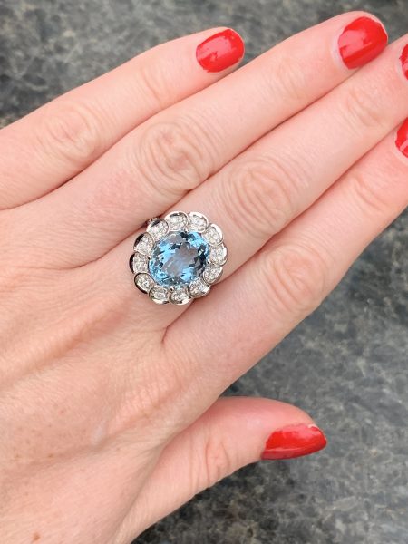 Model Finger shot Aquamarine and diamond cluster ring oval shape large
