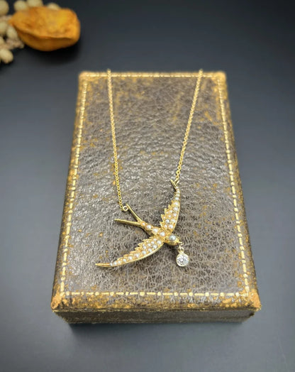 Antique 15 Carat Yellow Gold Swallow Pendant Necklace With Pearls And Diamond Drop