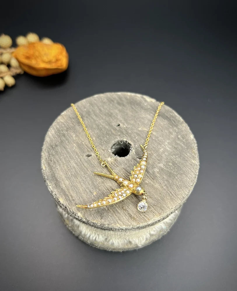 Antique 15 Carat Yellow Gold Swallow Pendant Necklace With Pearls And Diamond Drop