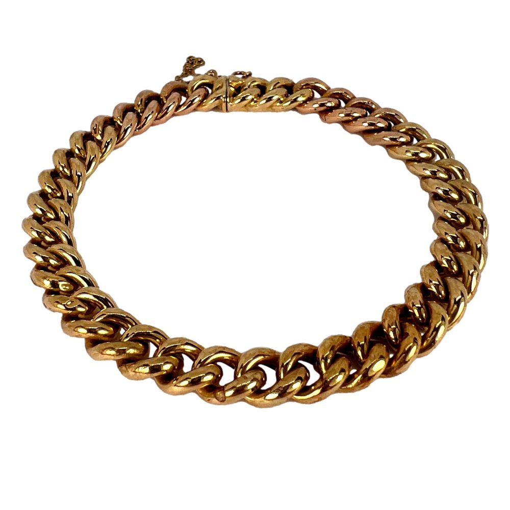 Curb link bracelet in yellow and rose gold.