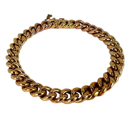 Curb link bracelet in yellow and rose gold.