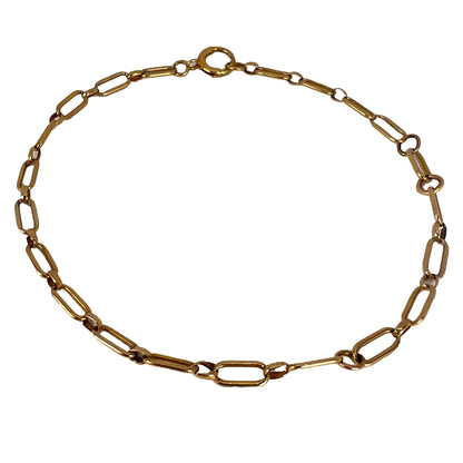 A yellow gold link bracelet with bolt ring clasp, on a white background