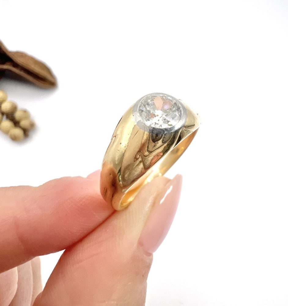 Antique gold gypsy band ring with single diamond.