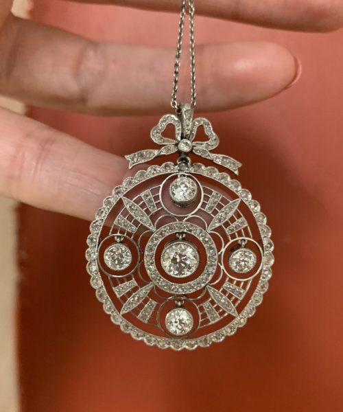 Antique Edwardian platinum diamond old cut pendant round bow articulated 1910