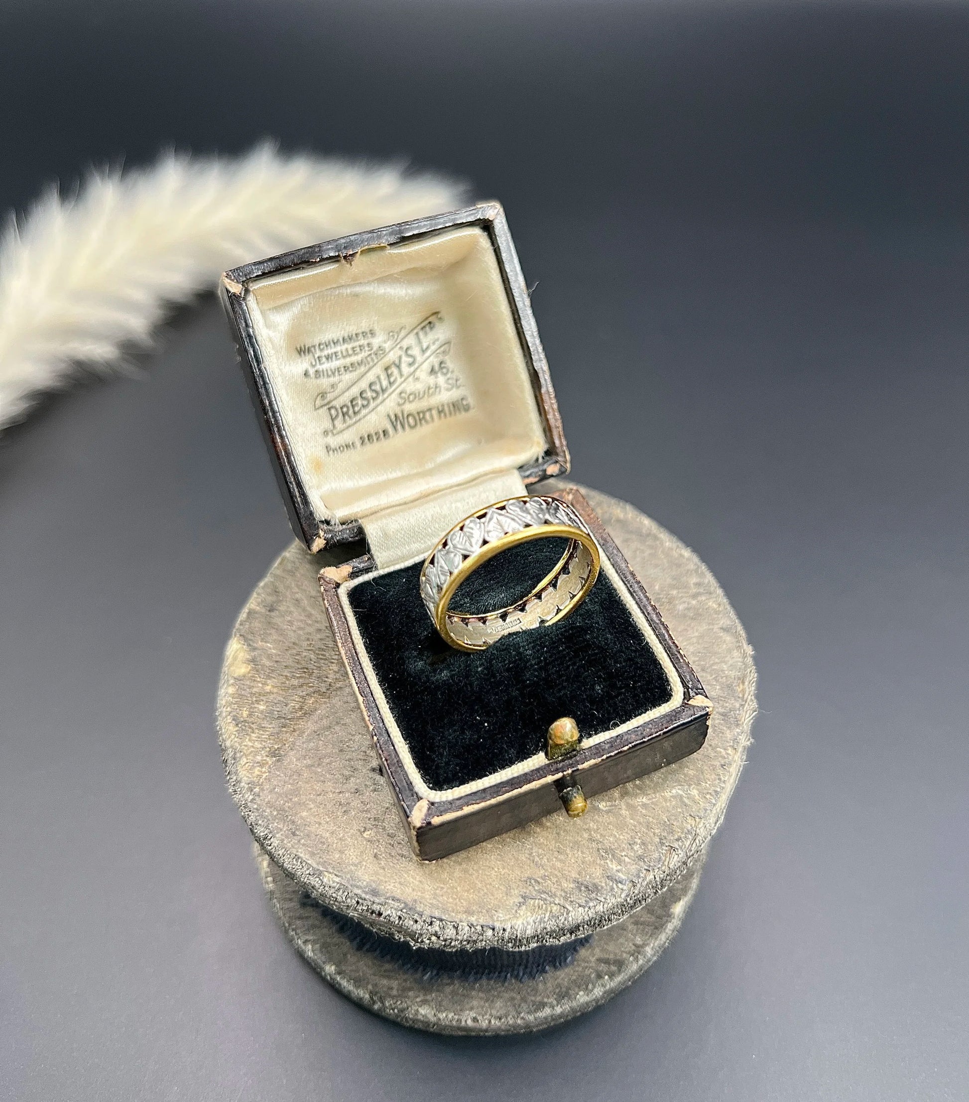 A yellow gold and platinum heart cutout band ring, in a ring box