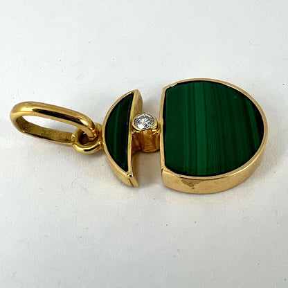A malachite and diamond yellow gold split circle pendant, on a white background