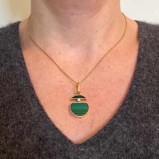 A malachite and diamond yellow gold split circle pendant, modelled on a gold chain