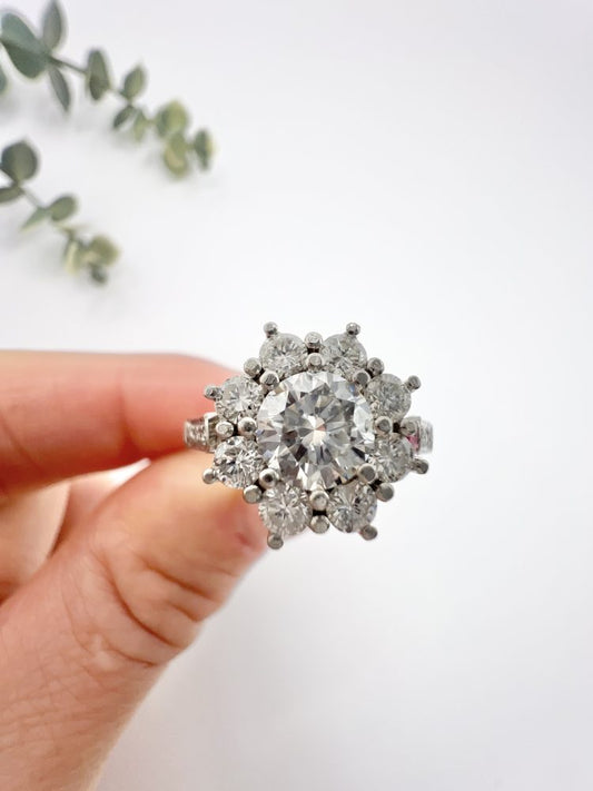 Diamond daisy cluster ring in platinum.