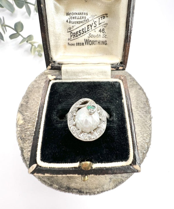 Edwardian Antique Pearl Emerald Diamond Snake Ring in Platinum, diamond-set snake coiled around pearl with emerald eyes in platinum, Circa 1910