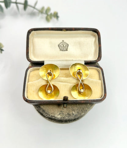 A pair of yellow gold oval engraved cufflinks, in an antique box