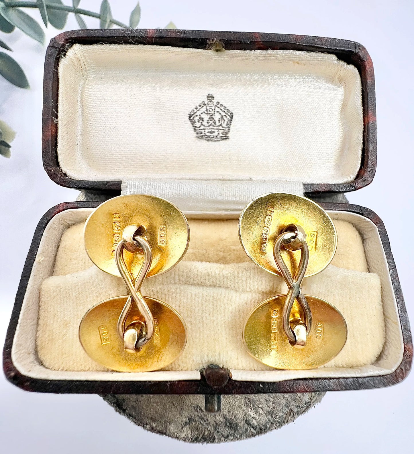 A pair of yellow gold oval engraved cufflinks, in an antique box