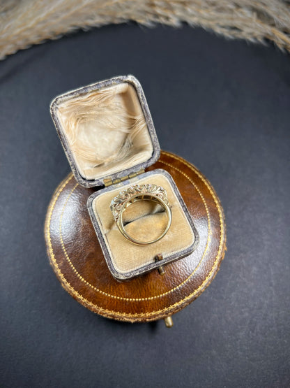 A cabochon opal and diamond carved half hoop ring in yellow gold, in a ring box