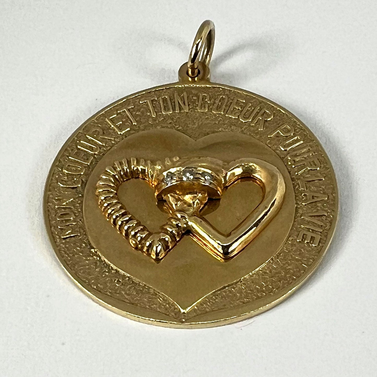 A round yellow gold love heart diamond pendant engraved MON COEUR ET TON COEUR POUR LA VIE