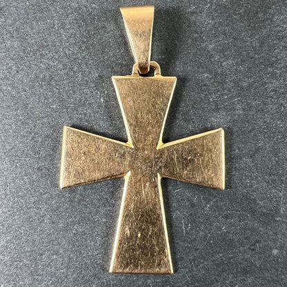 A plain gold cross pendant, on a grey background