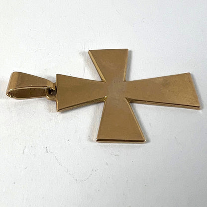 A plain gold cross pendant, on a white background