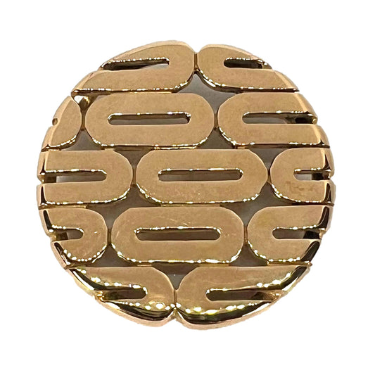 A gold oval motif circular pendant, on a white background