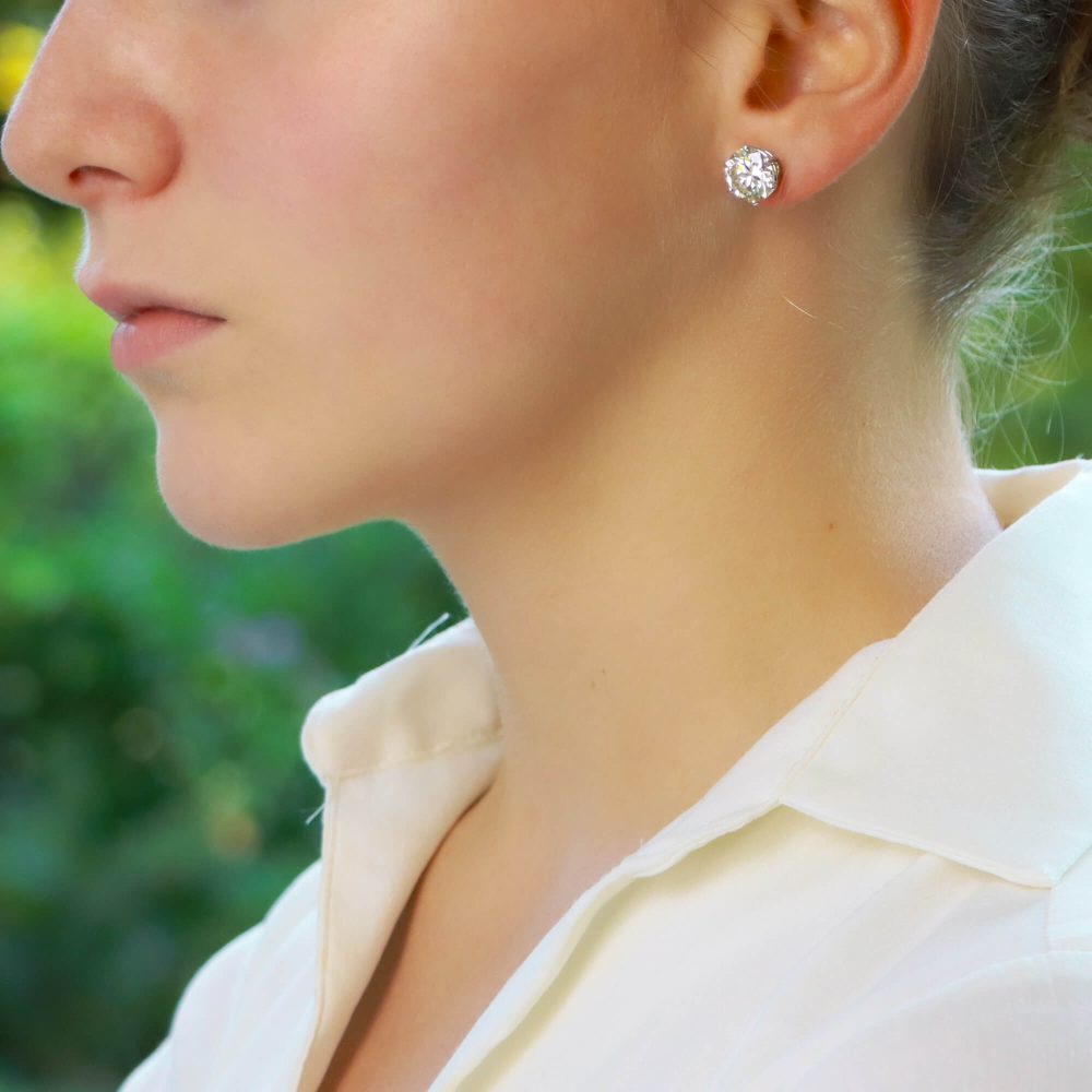 Solitaire certified diamond stud earrings set in gold,