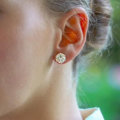 Solitaire certified diamond stud earrings set in gold,