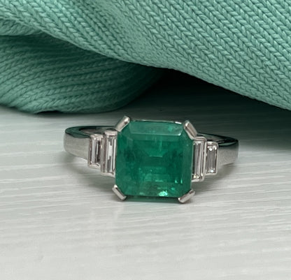 Art Deco Style Colombian Emerald and diamond shoulder engagement ring