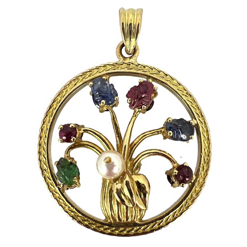 Flower vase pendant with gemstones in gold.