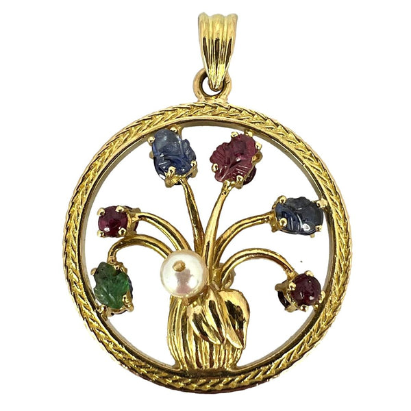 Flower vase pendant with gemstones in gold.