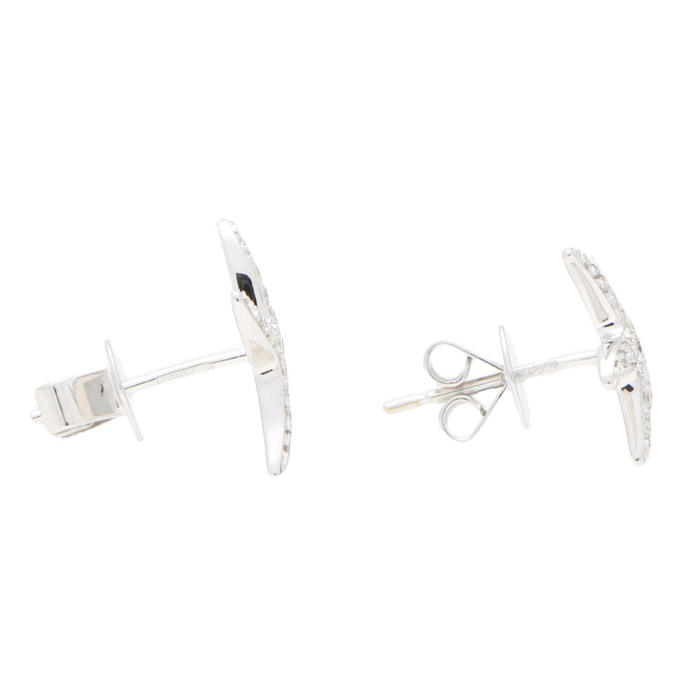 Diamond starfish stud earrings in white gold.