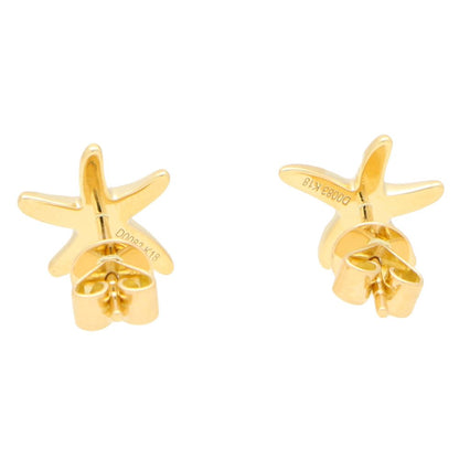 Modern diamond starfish stud earrings set in yellow gold.