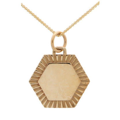 Hexagonal 9 carat yellow gold disc pendant.