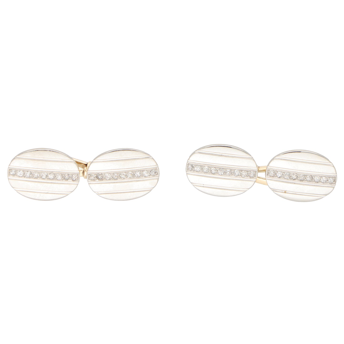 A pair of oval cufflinks in yellow and white metal set with diamonds, on a white background
