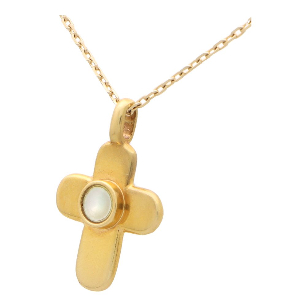 Van Cleef and Arpels mother of pearl cross pendant necklace set in yellow gold.
