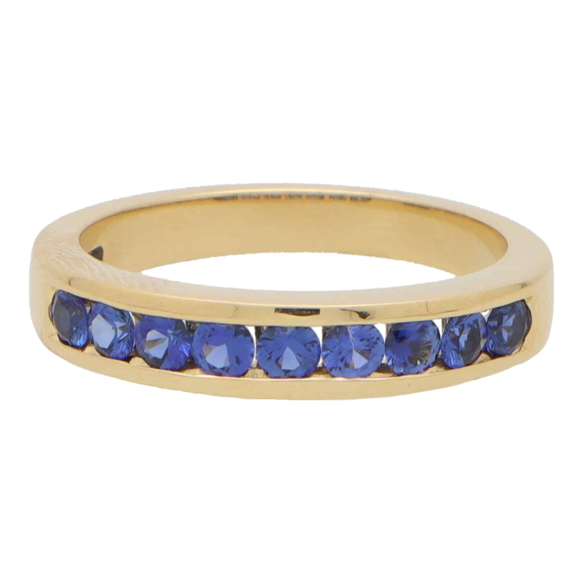 Sapphire half eternity ring set in 18 carat yellow gold.