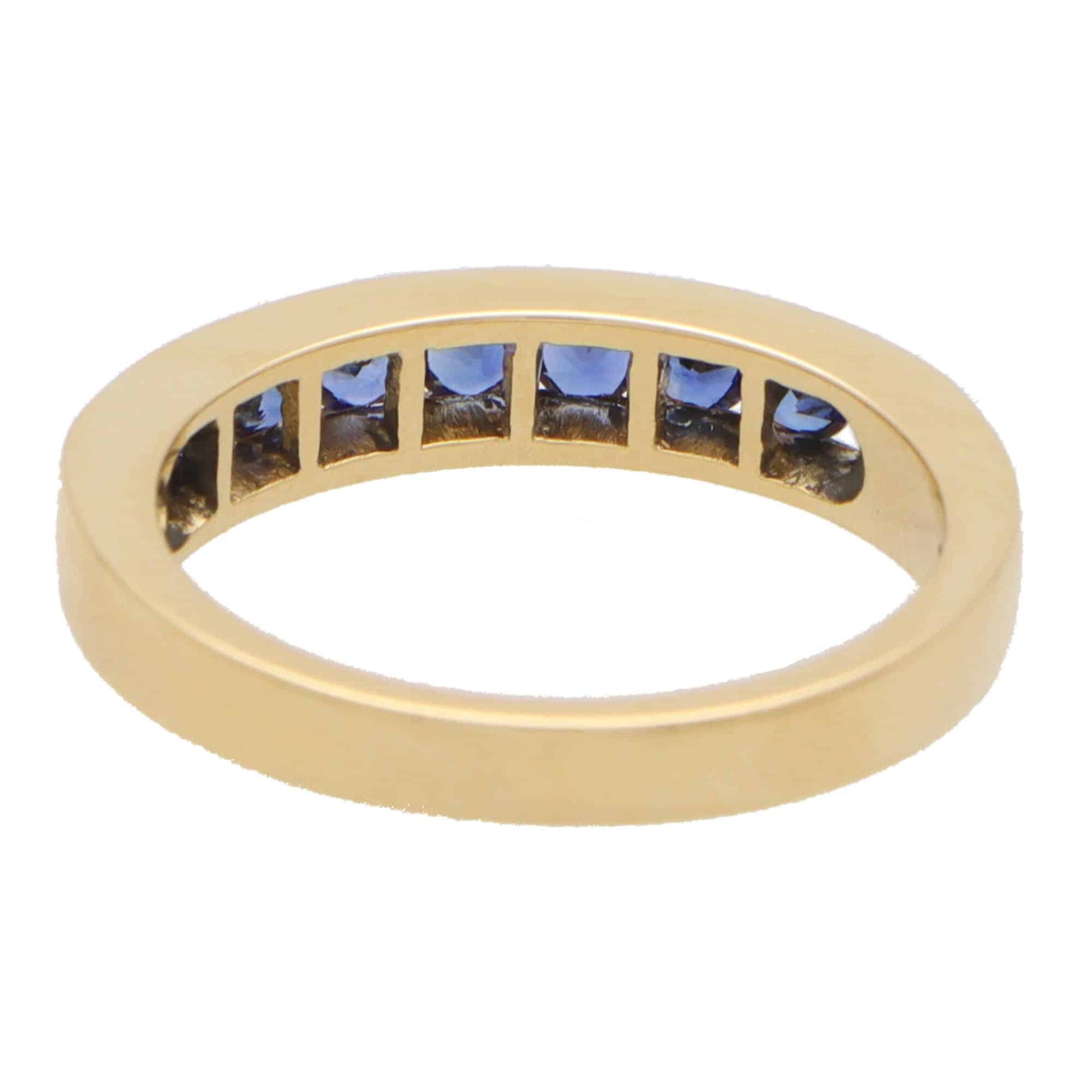Sapphire half eternity ring set in 18 carat yellow gold.