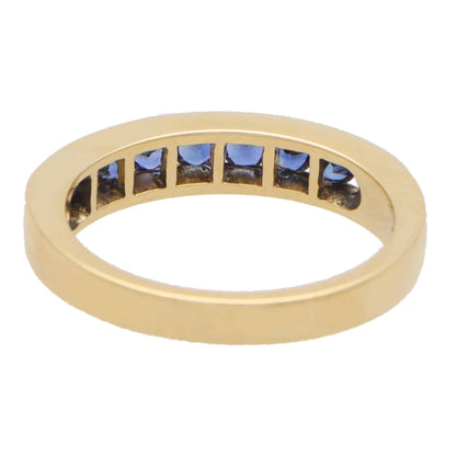 Sapphire half eternity ring set in 18 carat yellow gold.