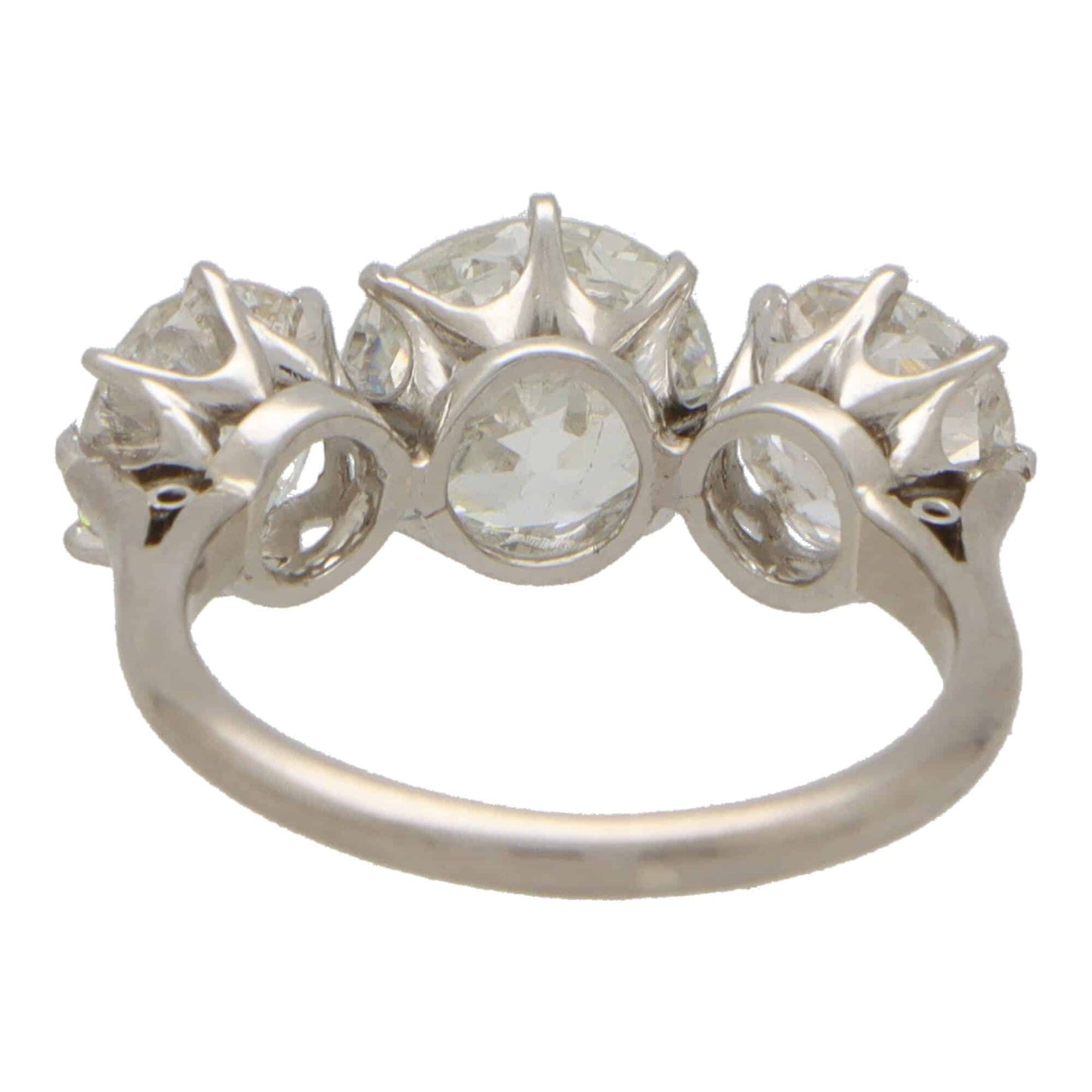 Vintage old mine cut 2.30 diamond three stone ring set in platinum.