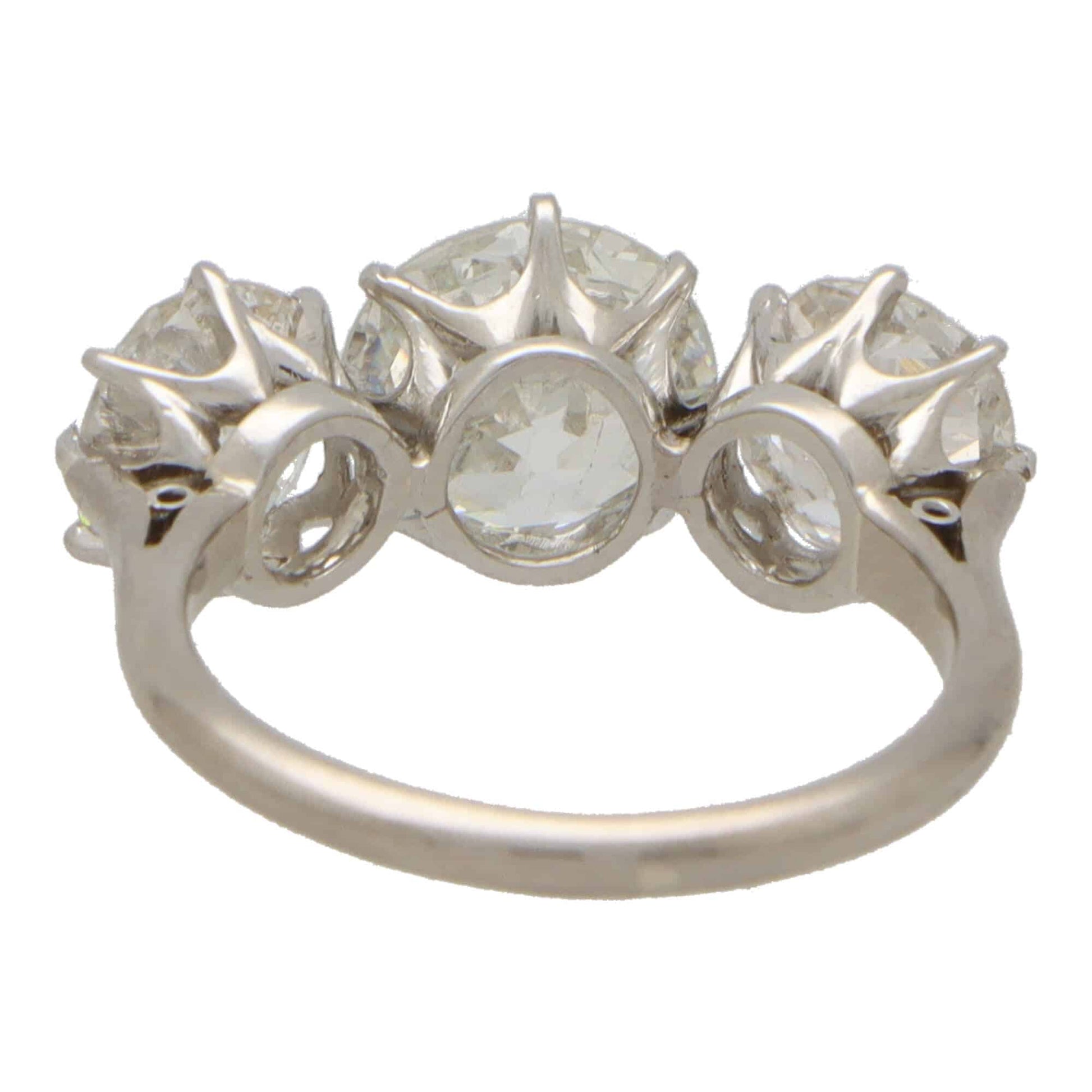 Vintage old mine cut 2.30 diamond three stone ring set in platinum.