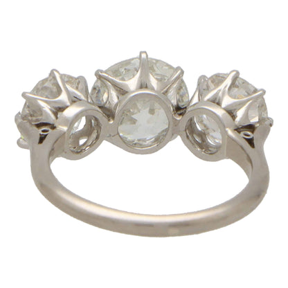 Vintage old mine cut 2.30 diamond three stone ring set in platinum.
