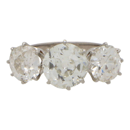 Vintage old mine cut 2.30 diamond three stone ring set in platinum.